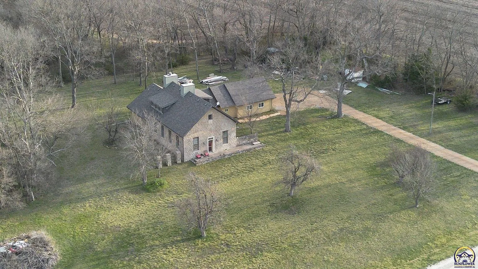 The schoolhouse and the addition from above with the lawn around them