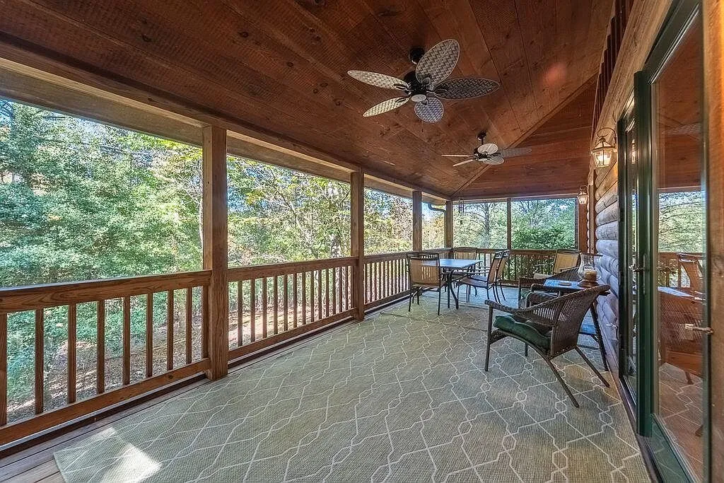 The screened porch's dining area with French doors to the great room