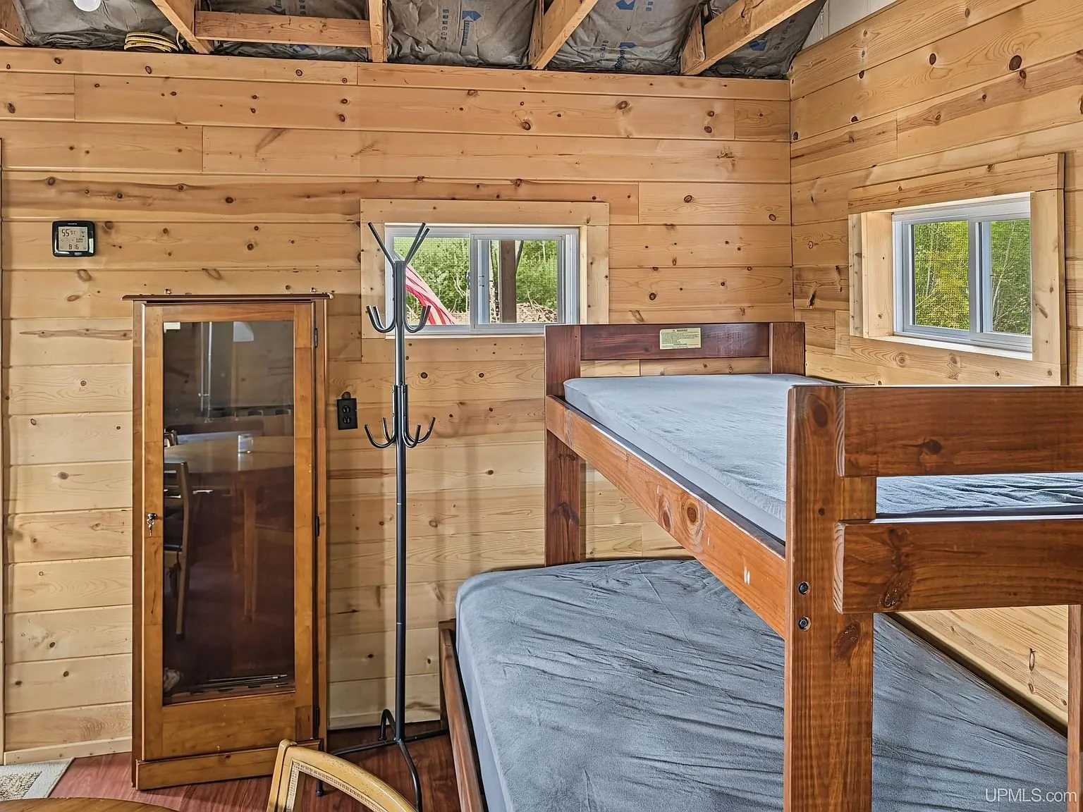 Bunk beds along the wall beside a small table