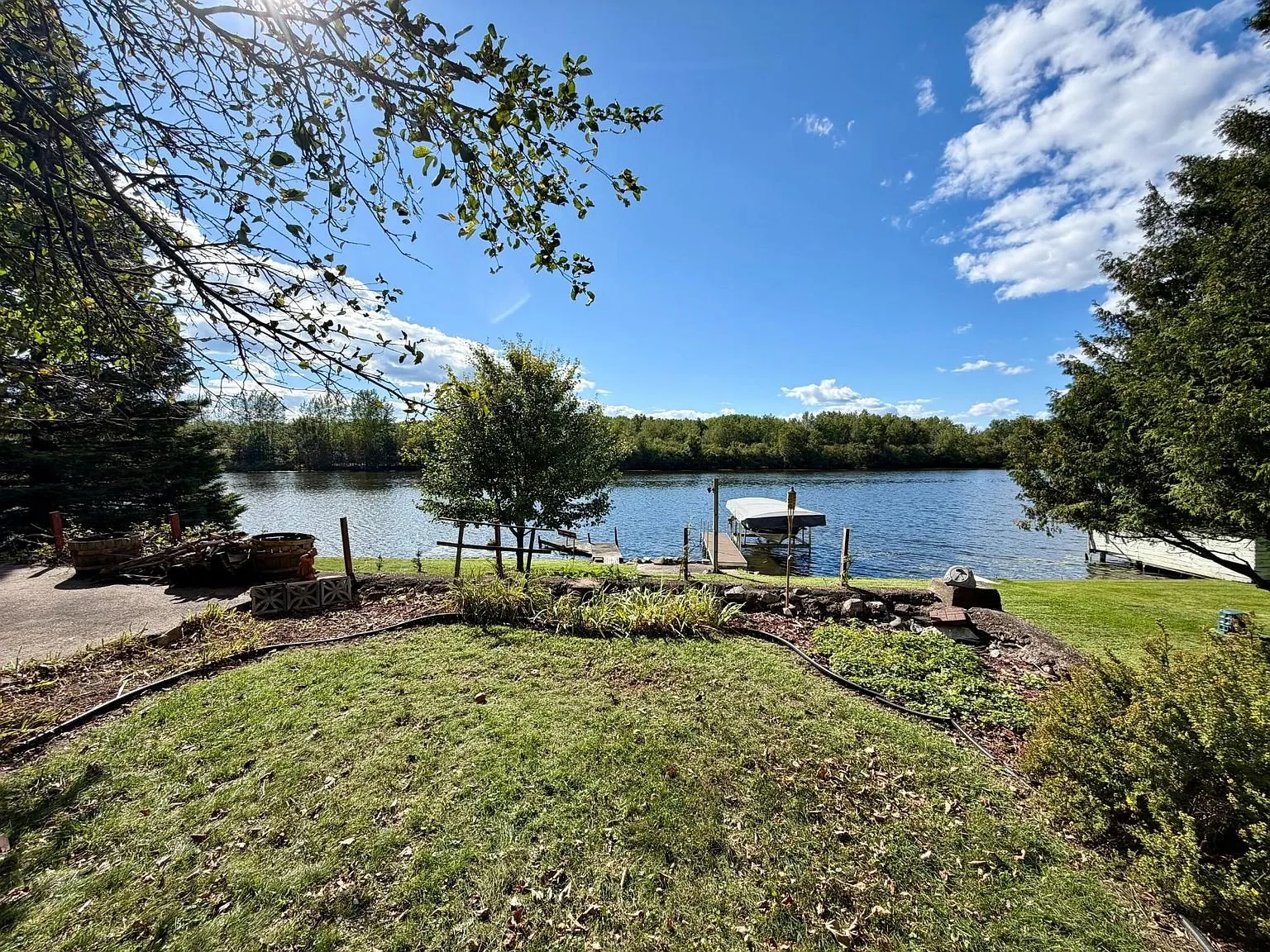 The yard sloping to the water with the dock