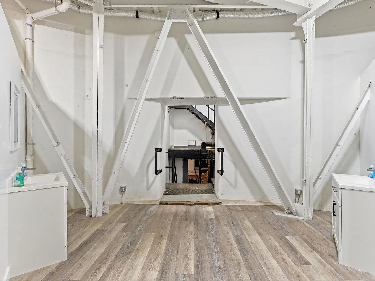 Inside the silo's upper bay, showing the steel cross-bracing and open floor