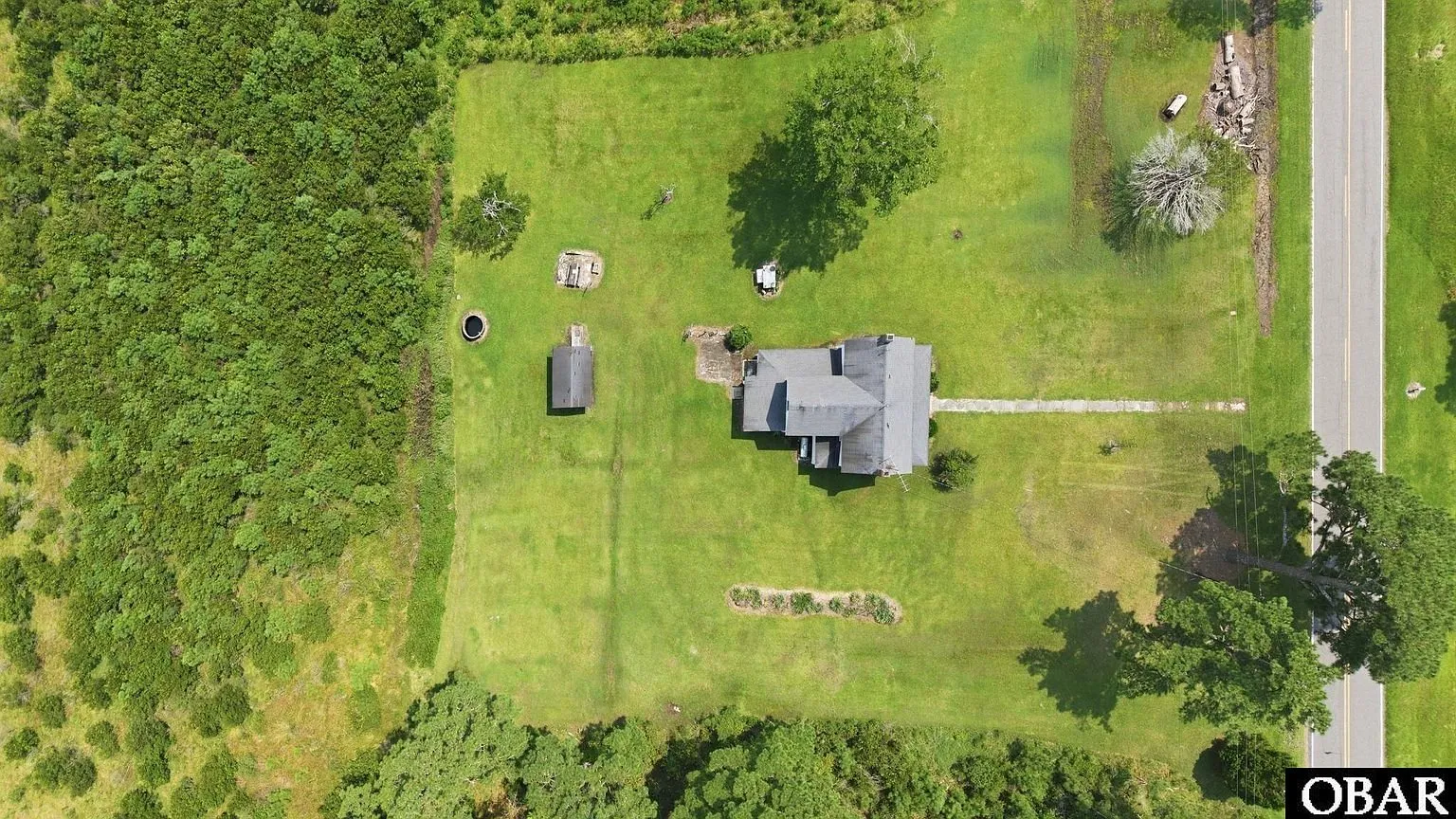 Straight-down aerial of the house, shed and yard