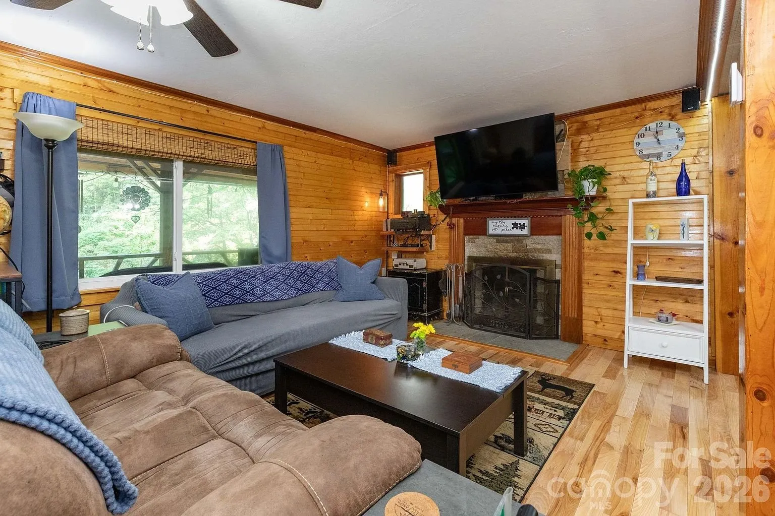 The living room toward the fireplace and the television