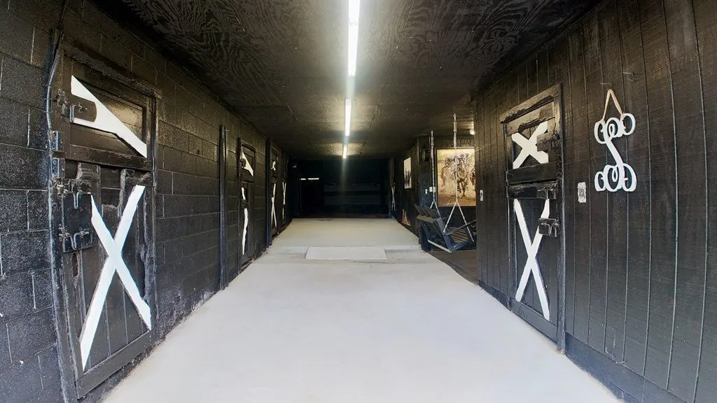 The length of the barn interior, lit from above