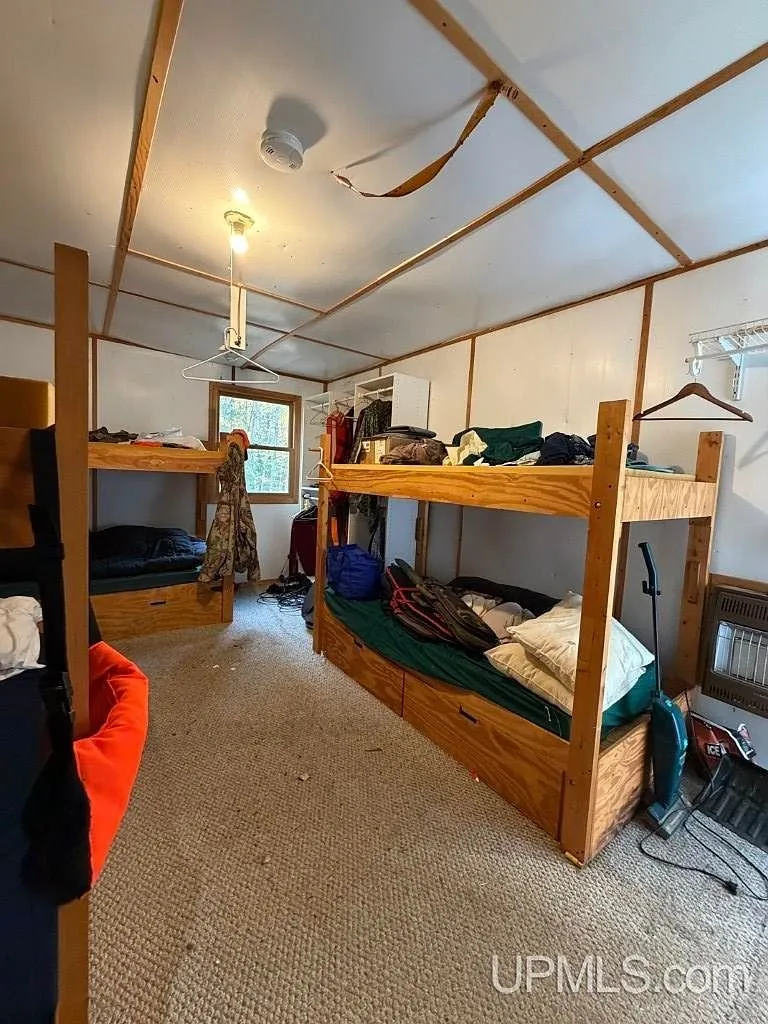 Bunk beds built along the bunkhouse wall