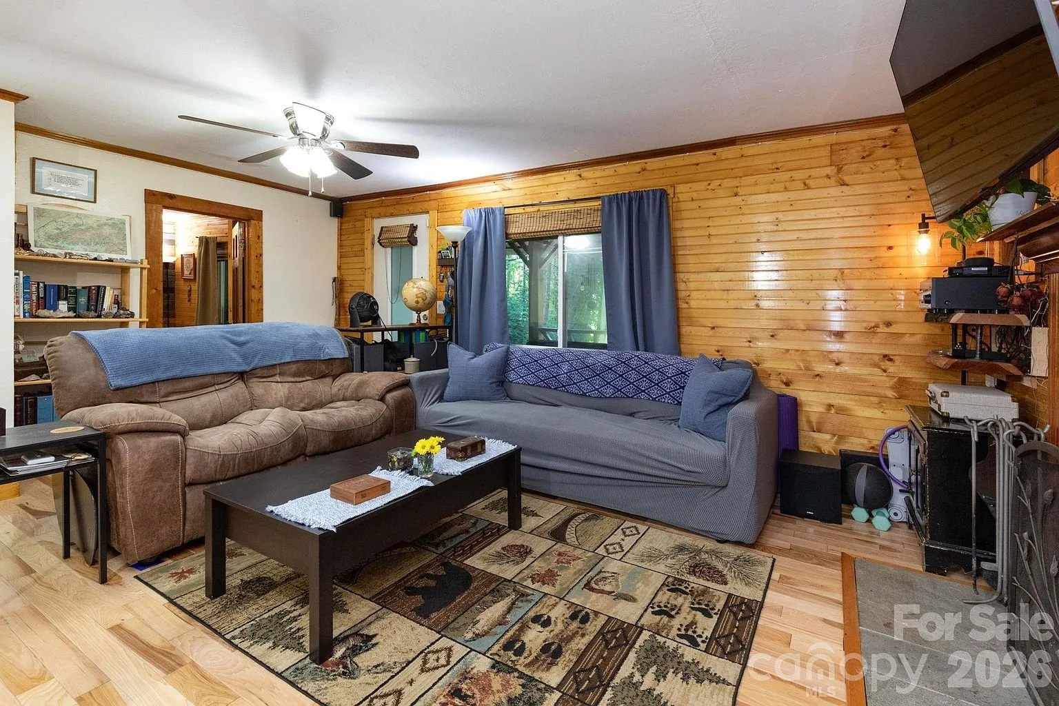 The living room with the two sofas and the rug