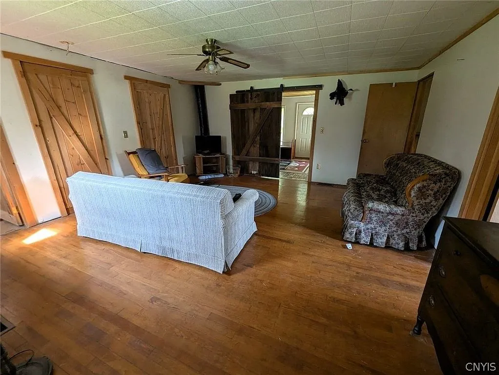 The living room toward the barn doors and the far room