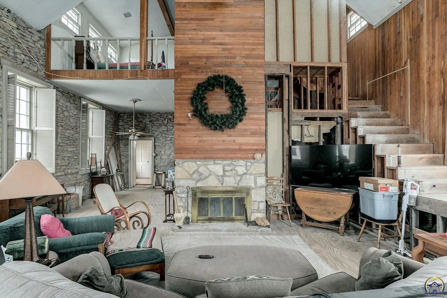 The great room toward the fireplace and the stair to the loft
