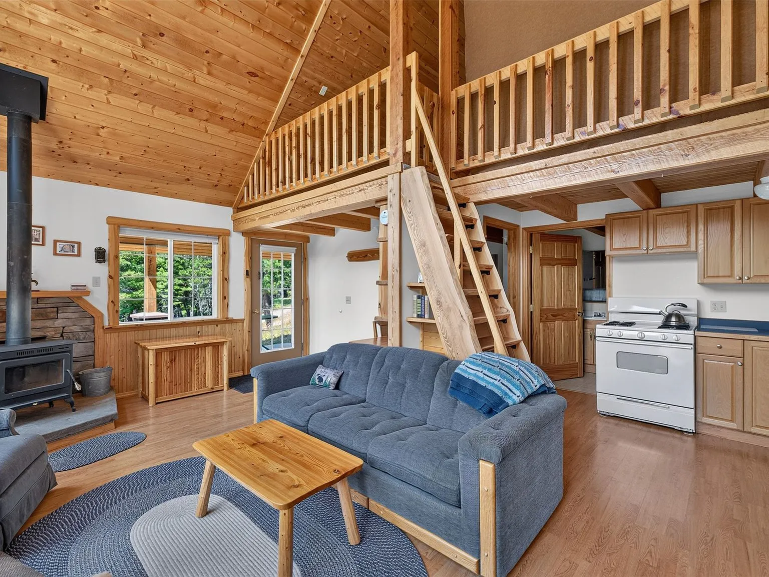 The wood staircase's open treads leading up from the main floor