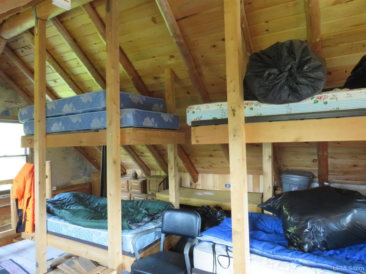 The bunkhouse loft with built-in bunks under the rafters