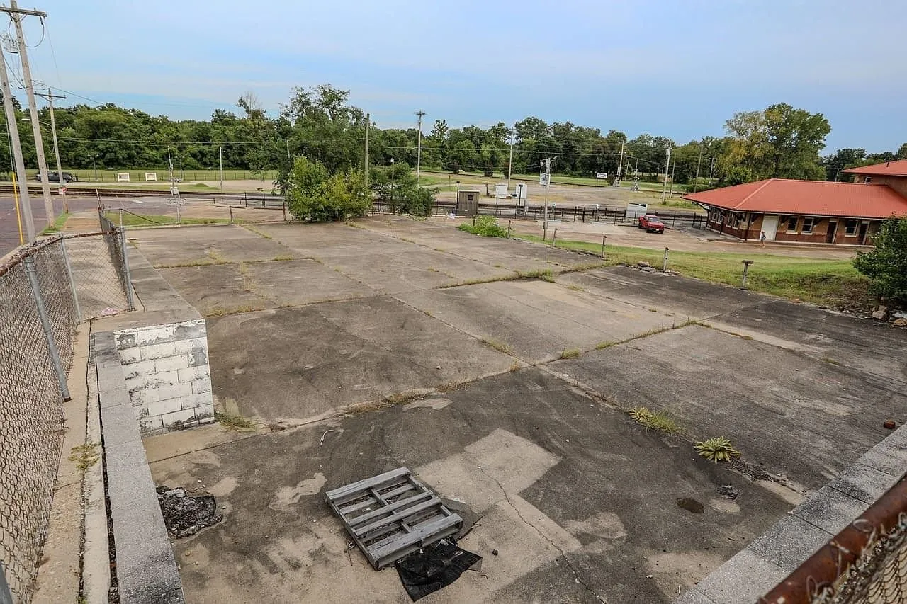The parking lot from the corner with the old building slab in it