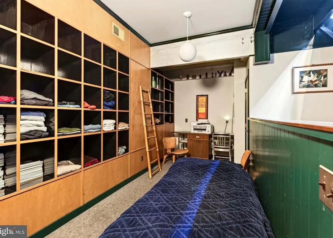 A second view of the lower-level bedroom and its built-in storage