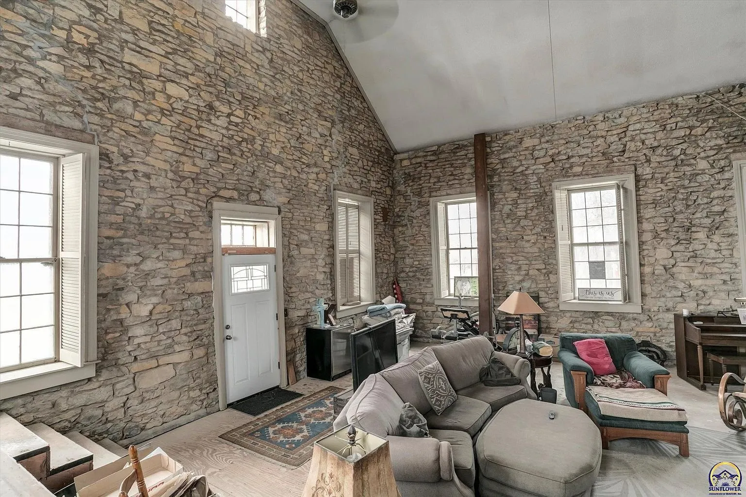 The great room toward the front door with the windows on both sides