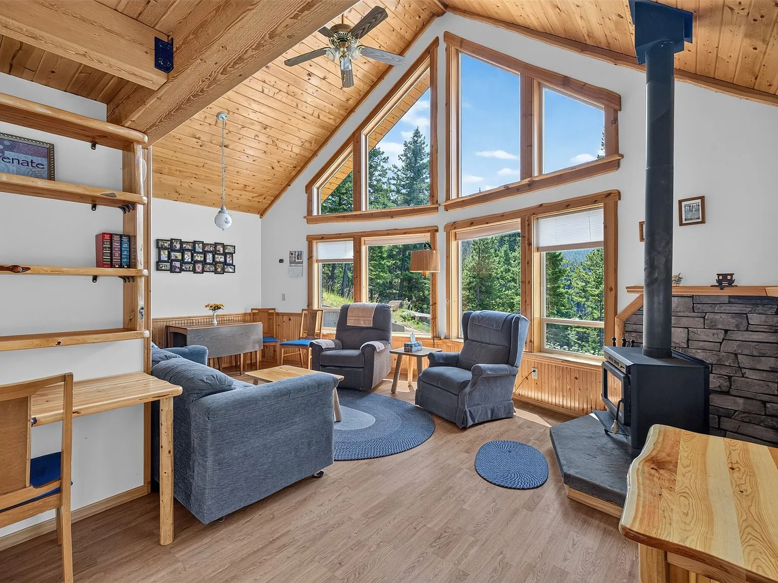 A wide view of the open living and loft area, with the staircase and kitchen visible