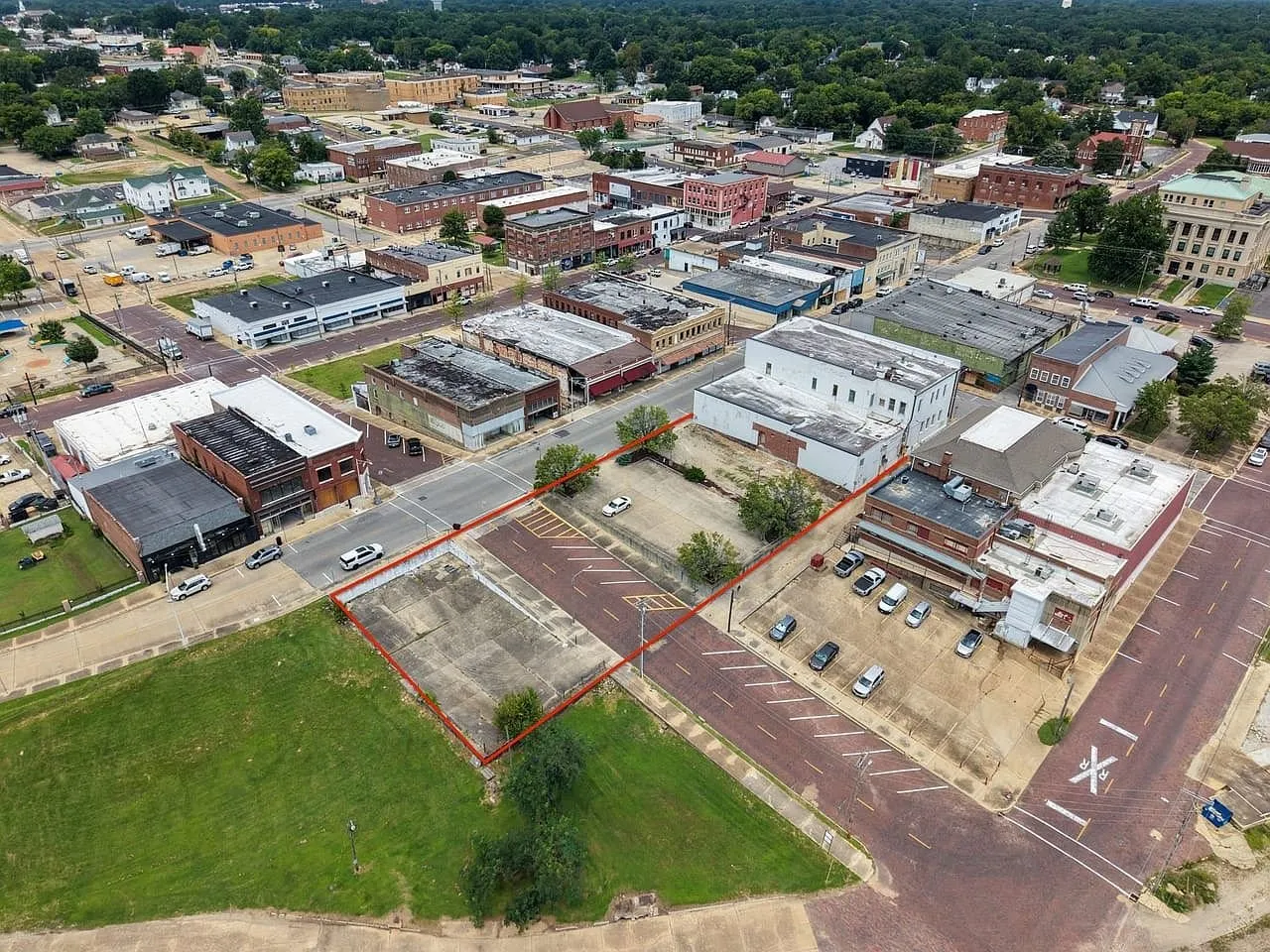 Aerial with the parking parcel outlined in red across Cedar Street from the building