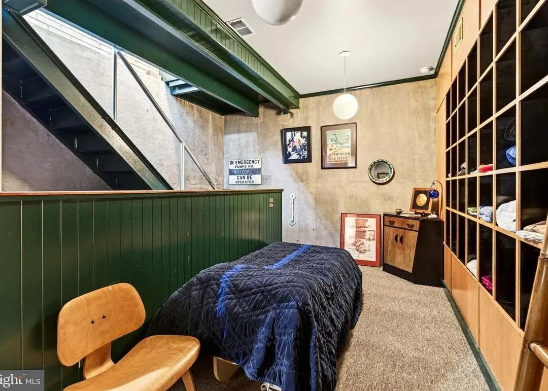 The lower-level bedroom seen from the stairway landing