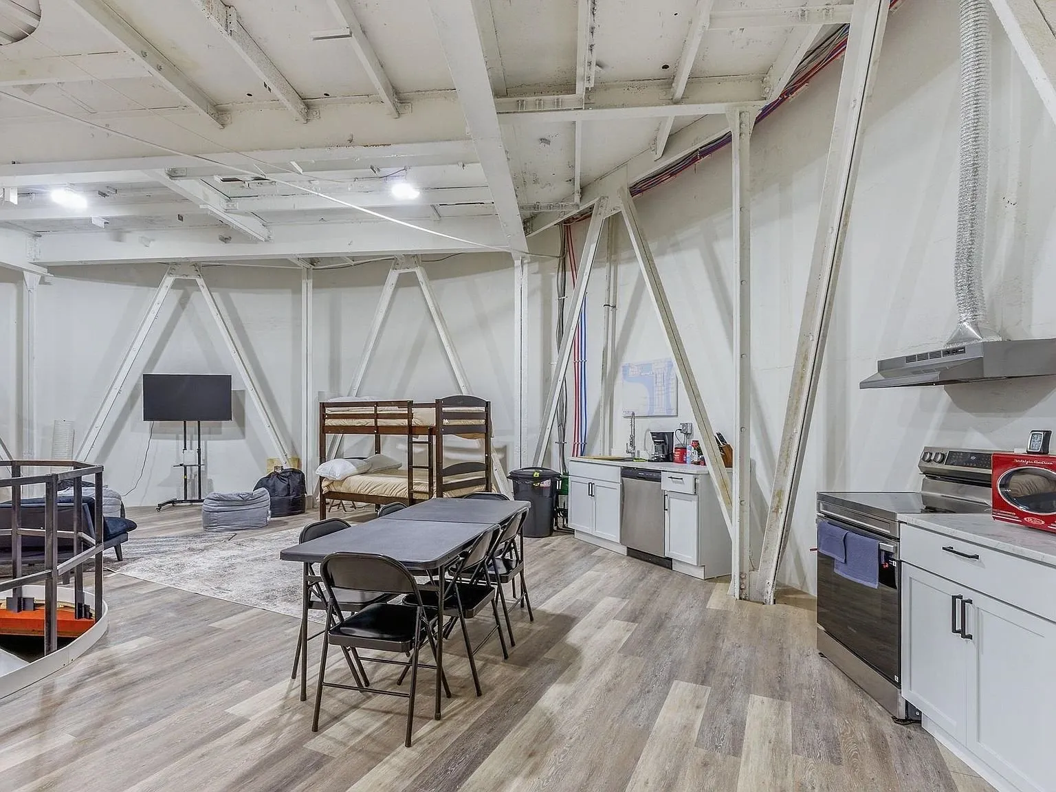 A dining and prep area built into the silo with a card table and folding chairs