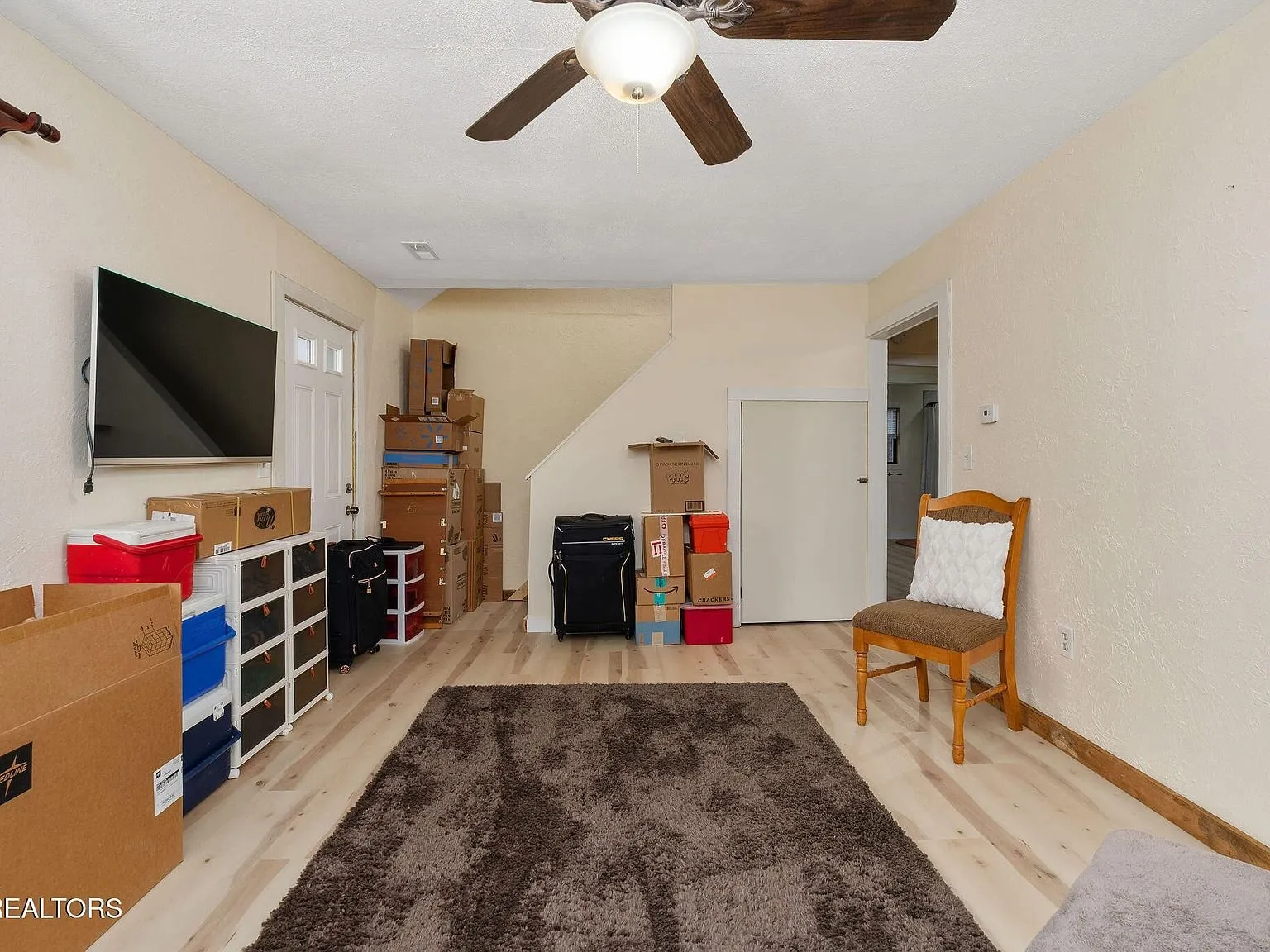 A hallway closet and door near the kitchen