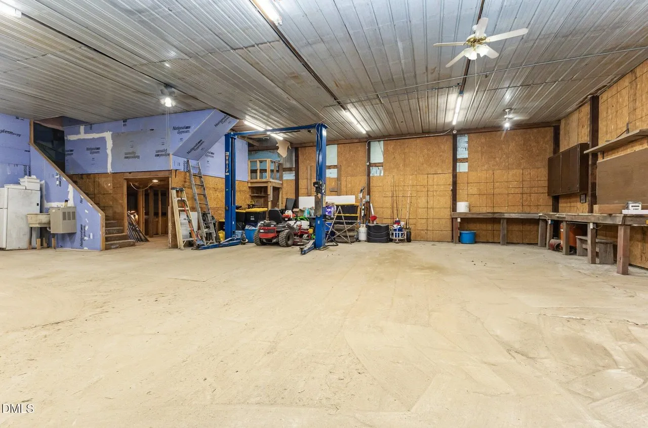The shop interior looking the other way, open floor and the stairs to the unfinished upstairs