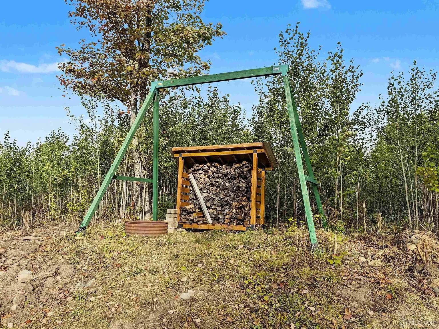 The shed and camp among birch trees in fall color