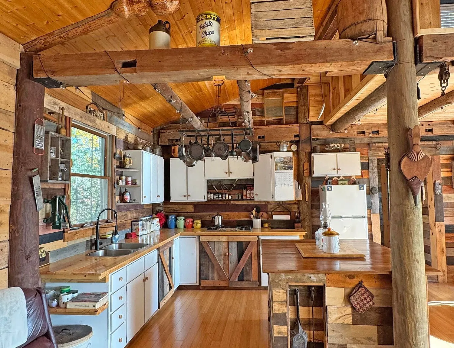 The kitchen from the far corner, window over the sink