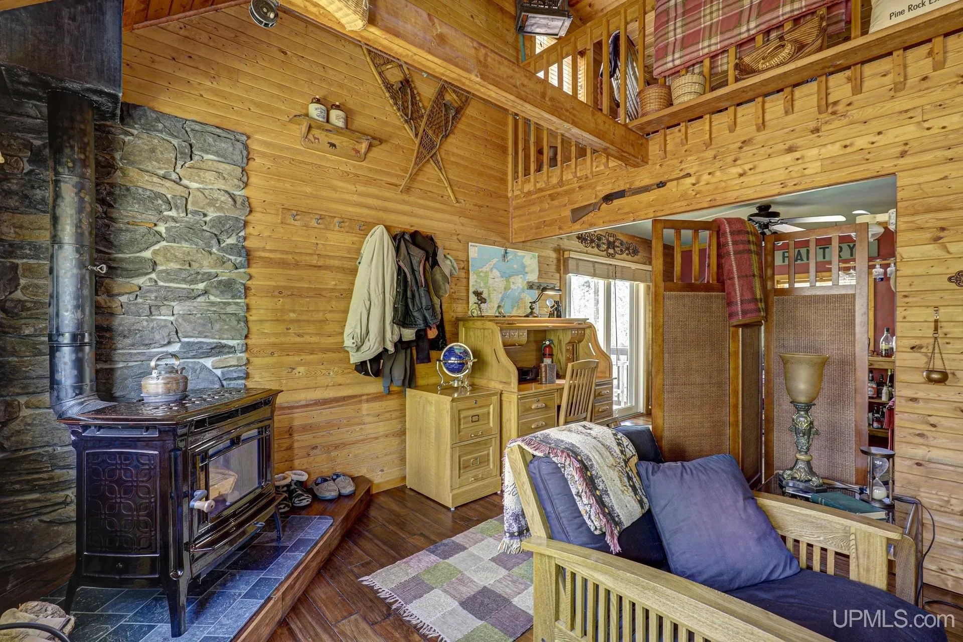 The wood stove and the futon under the loft