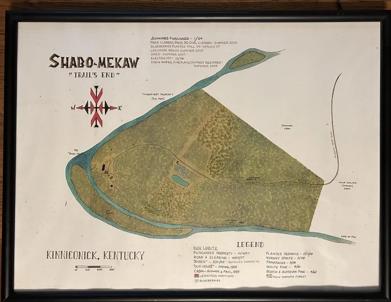 A framed survey map of the tract showing the creek wrapping the boundary