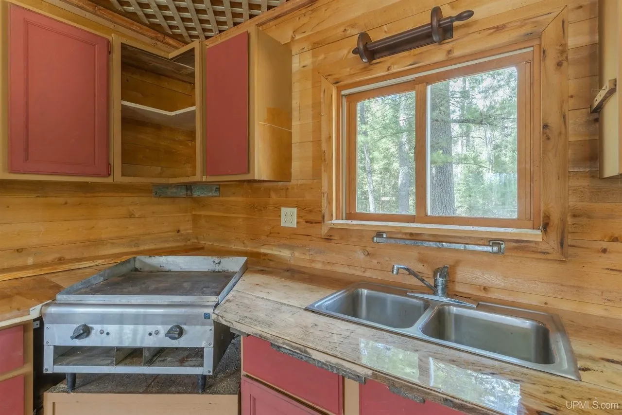 The built-in griddle and double sink along the kitchen counter