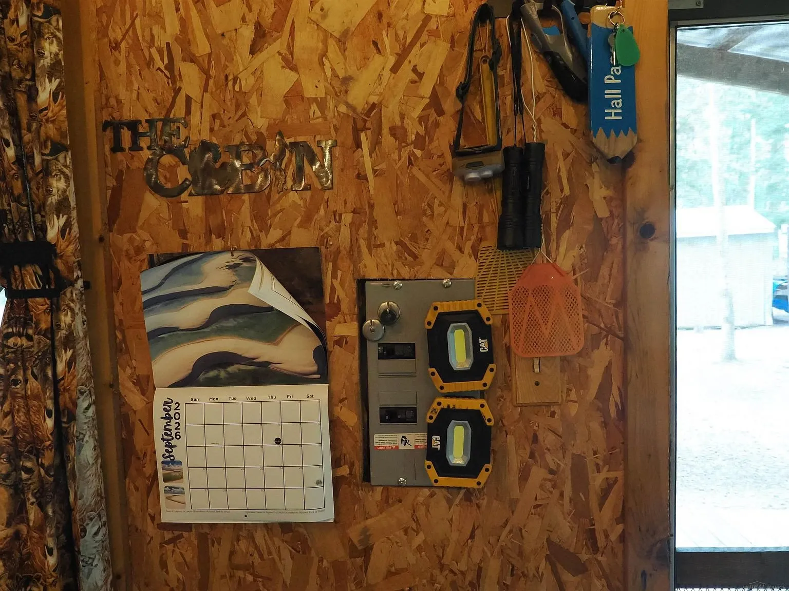 The panel with the gauges and the calendar by the door