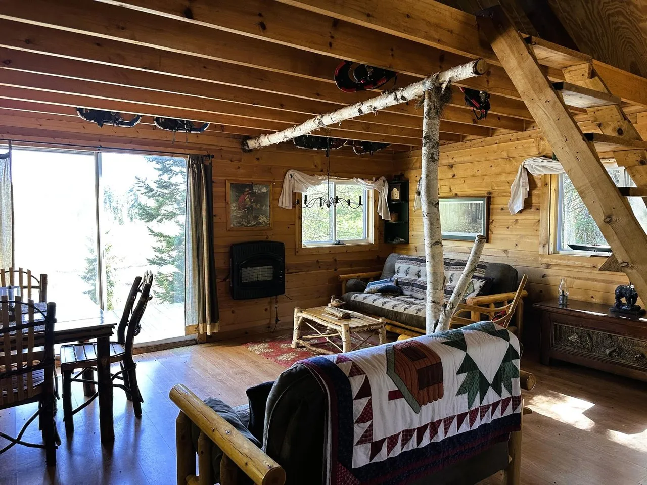 The main room looking toward the sliding door and the woodstove