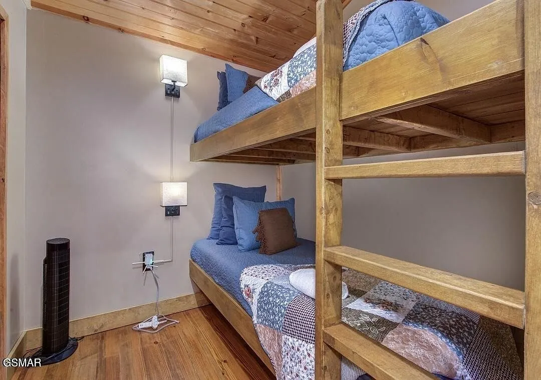 Built-in bunk beds in a paneled alcove