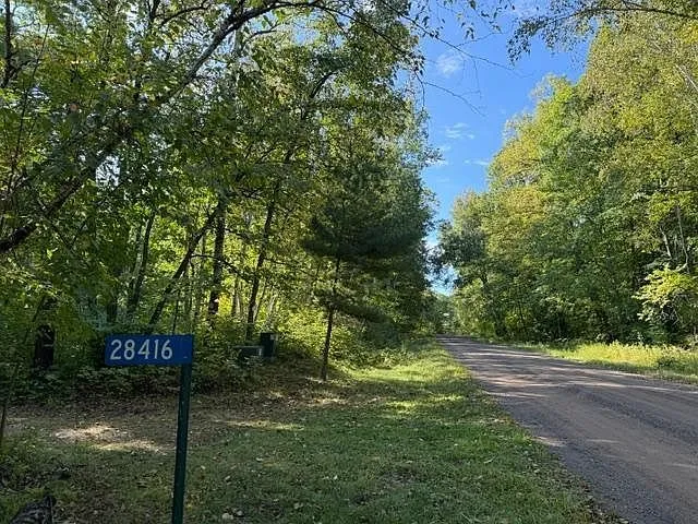 The gravel lane with the 28416 sign at the driveway