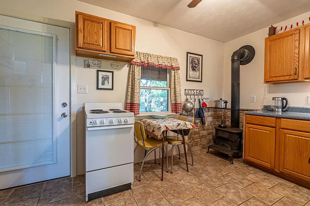 The kitchen counter and sink beneath the stairway to the loft