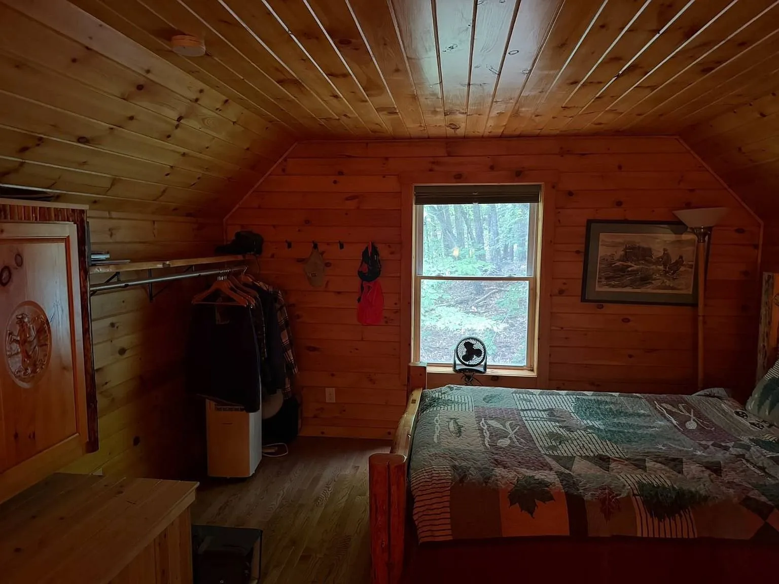 The loft bedroom from the other end with the rail