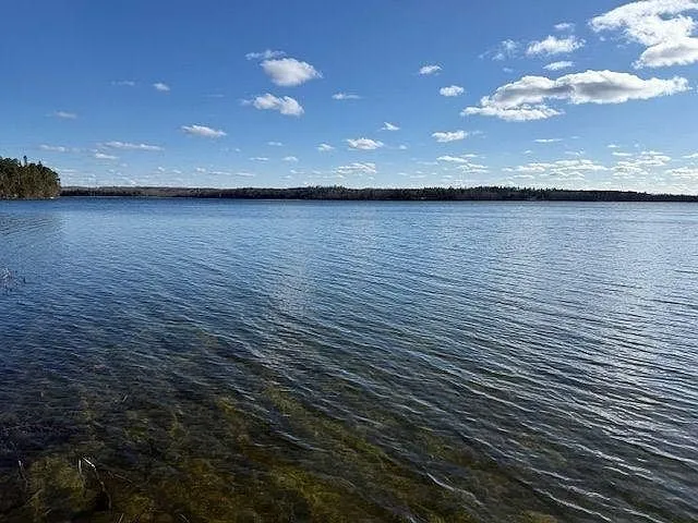 The lake under a blue sky from the shore