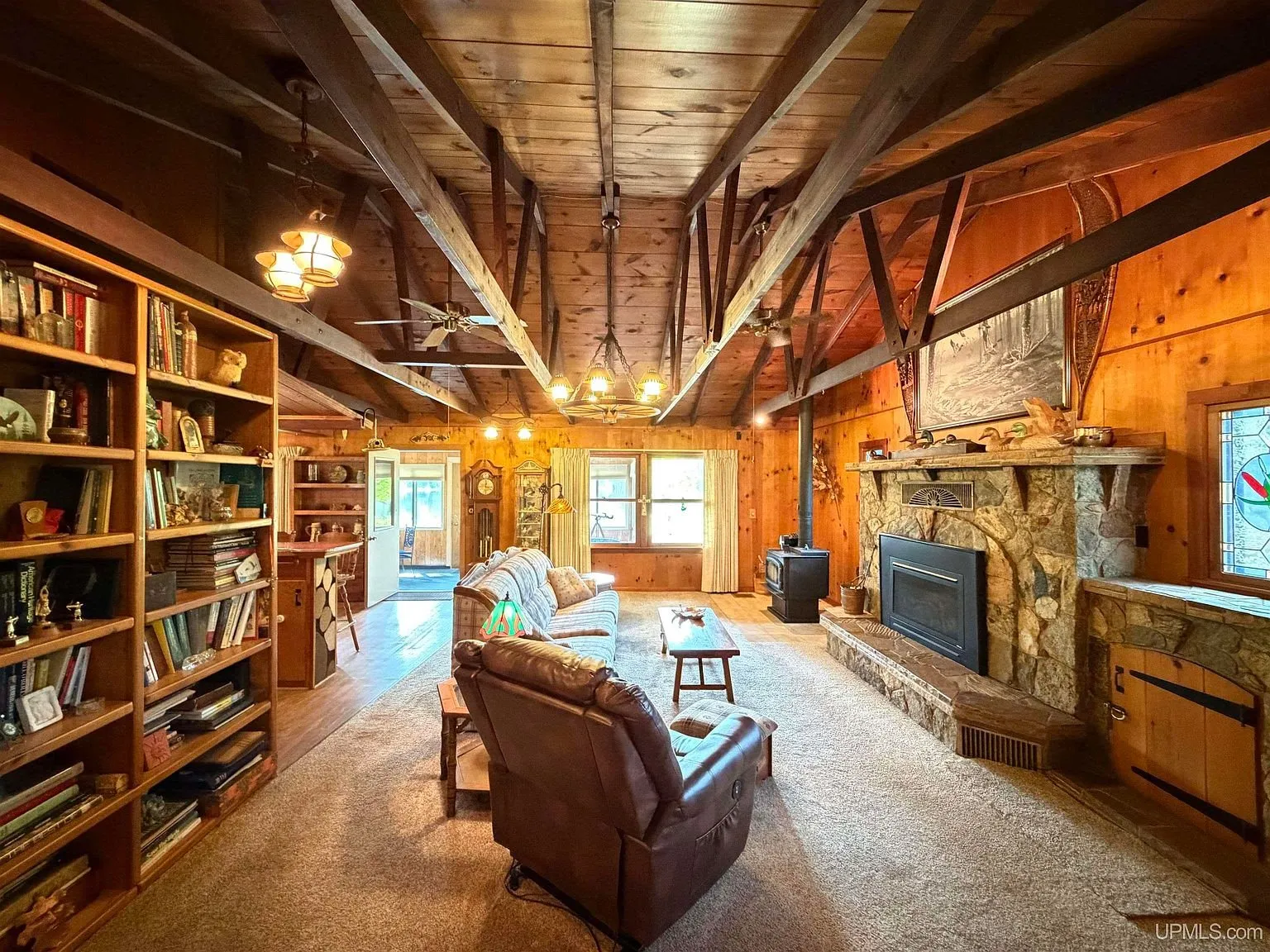 The living room with the built-in bookshelves