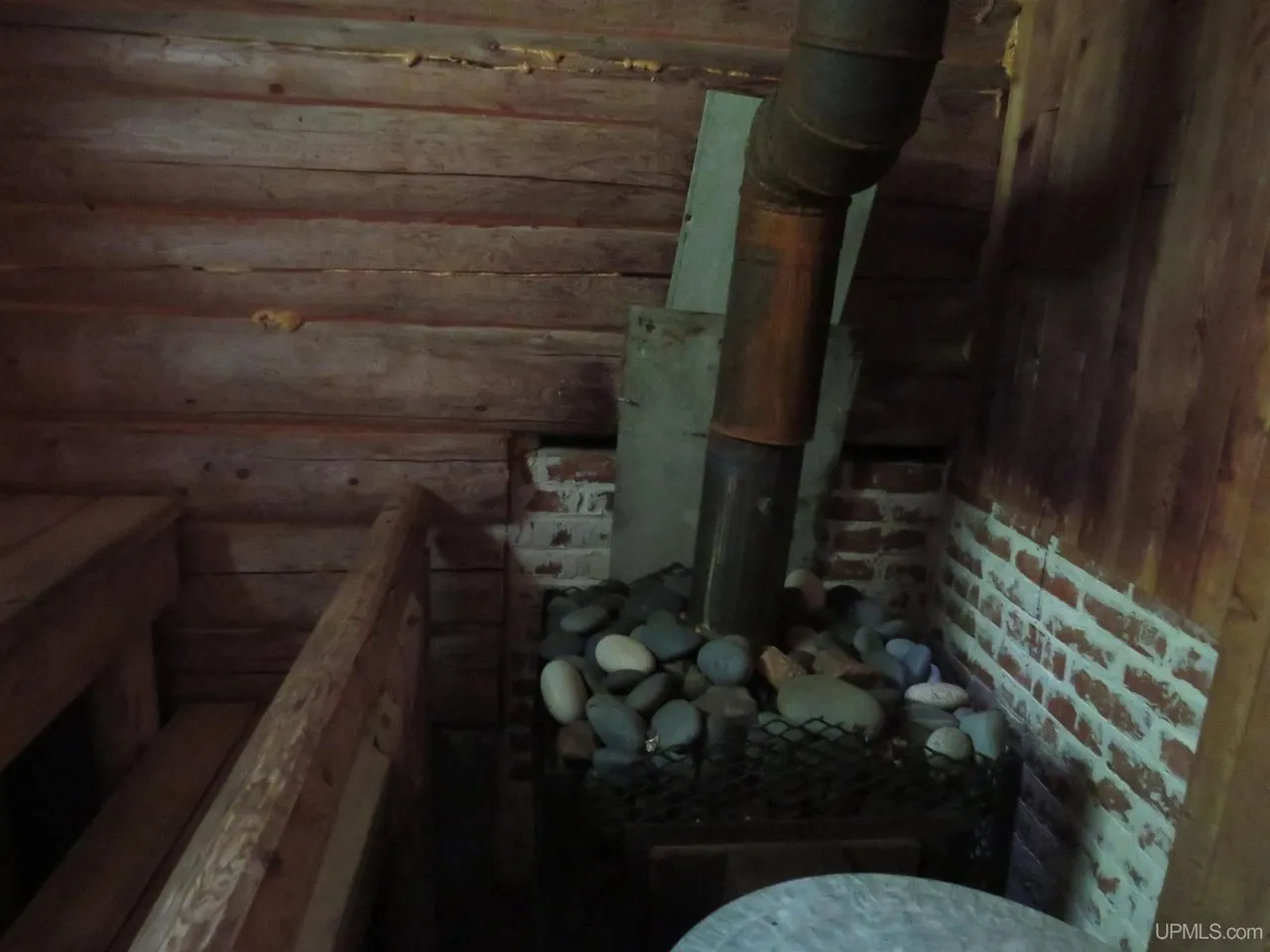 The sauna stove piled with rocks