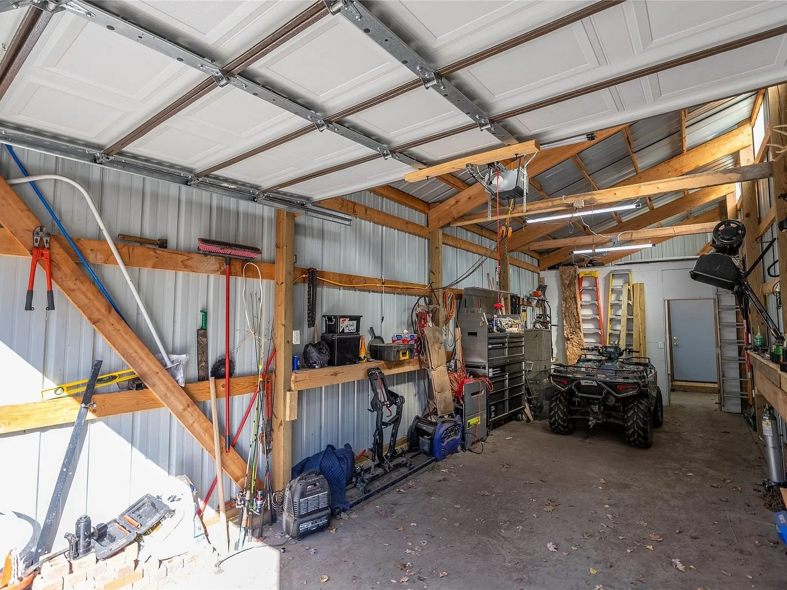 The attached garage bay's interior workbench and storage area