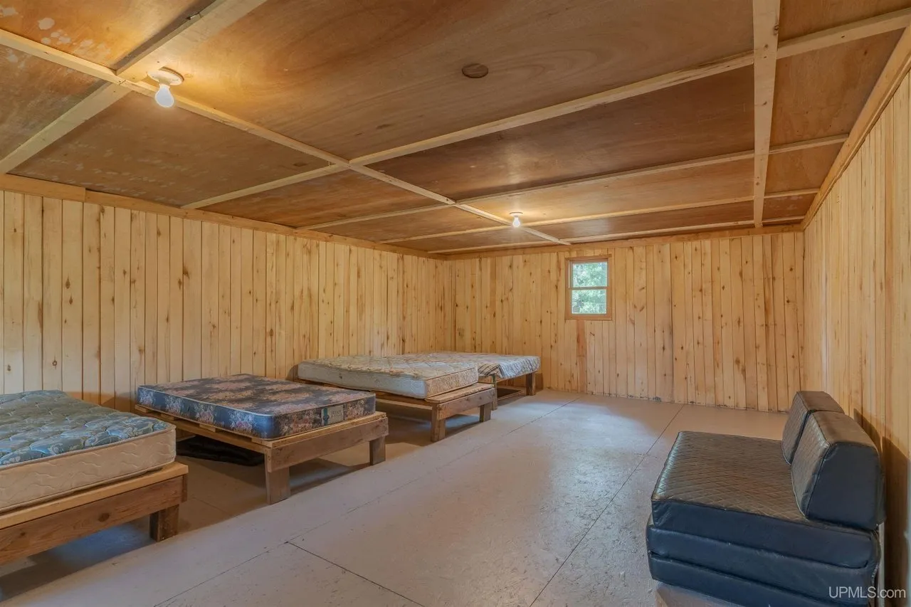 The upstairs bunk room with beds along the wall