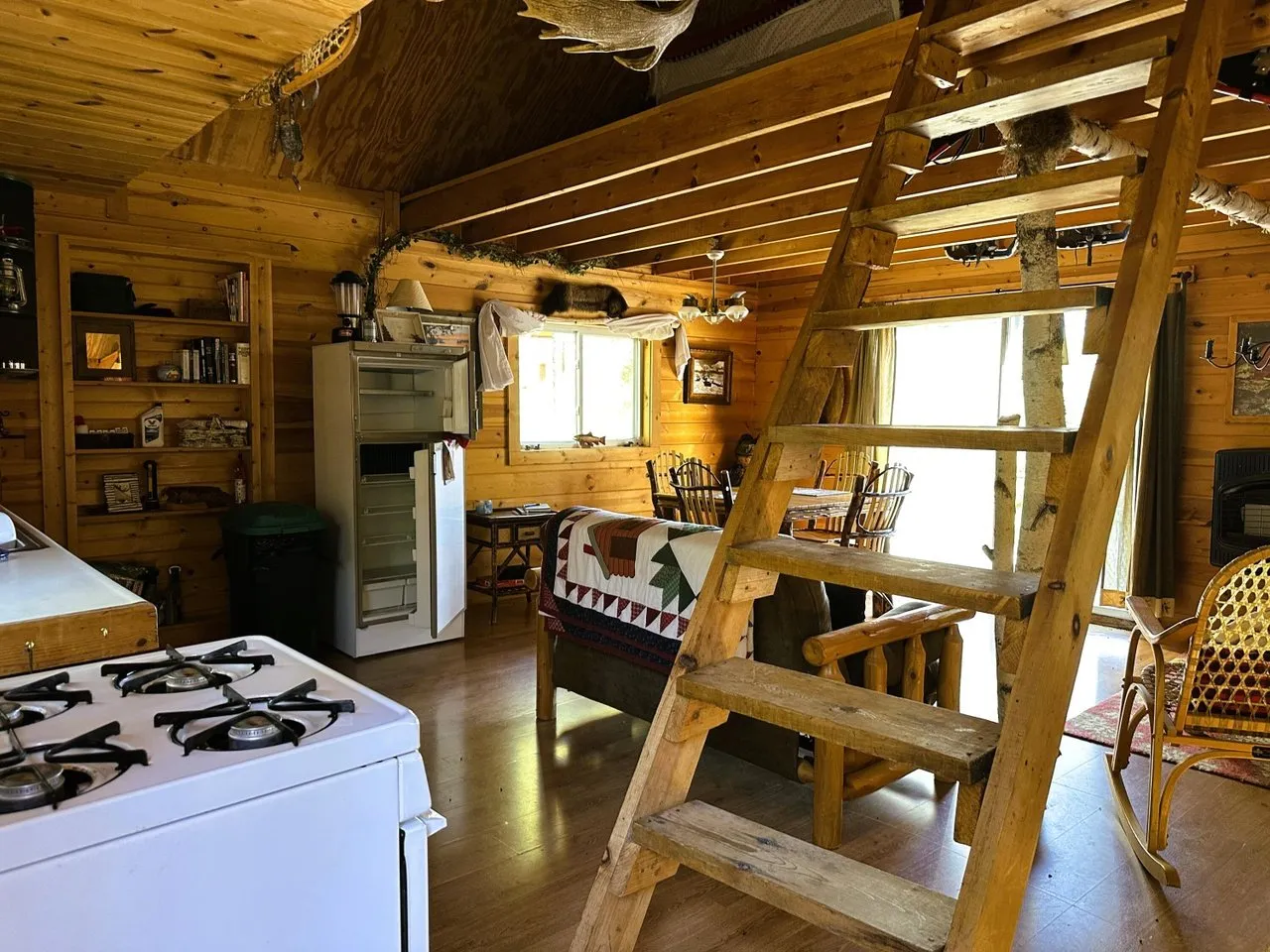 The gas range and kitchen counter beside the loft ladder
