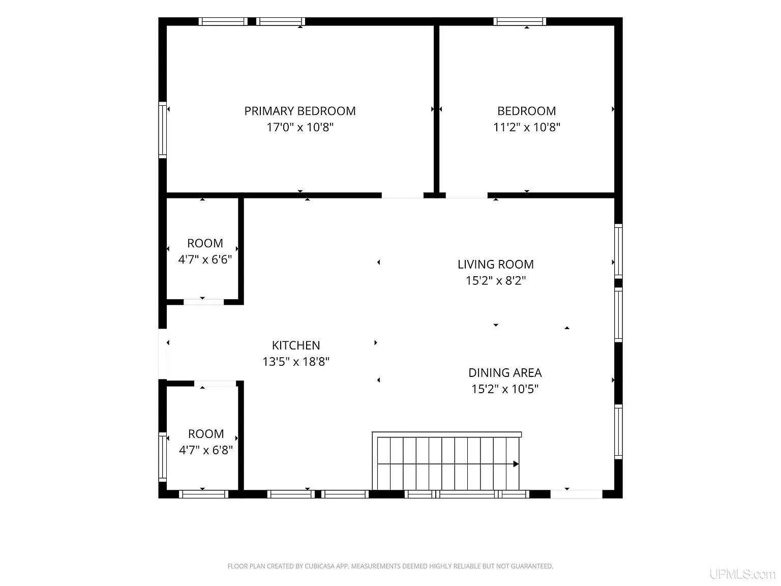 The floor plan of the main level with two bedrooms, the kitchen, the living and dining areas and two small rooms