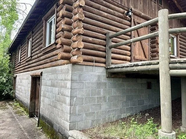 The block walkout basement under the log cabin