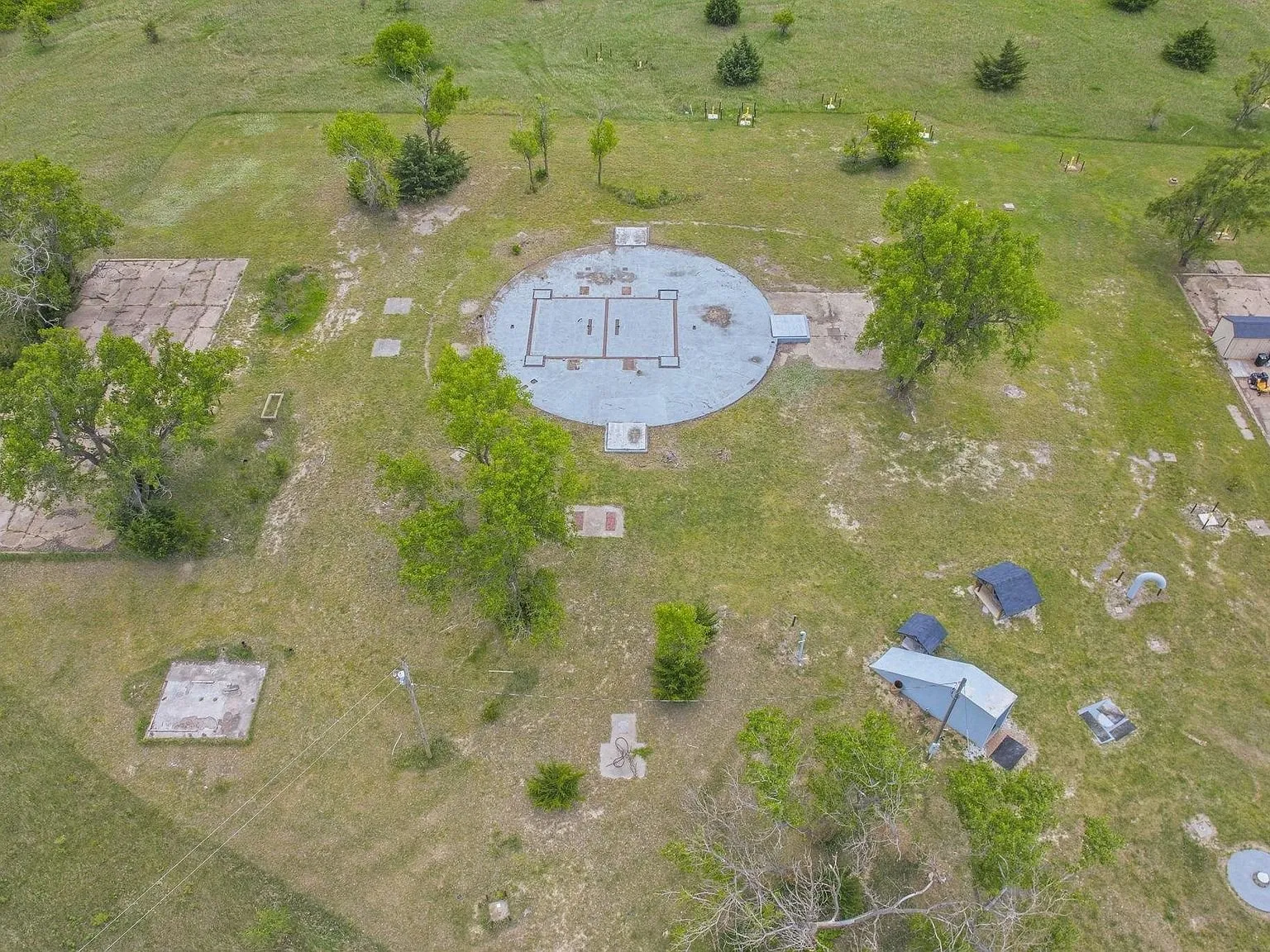 An aerial view looking down the length of the deeded driveway toward the road