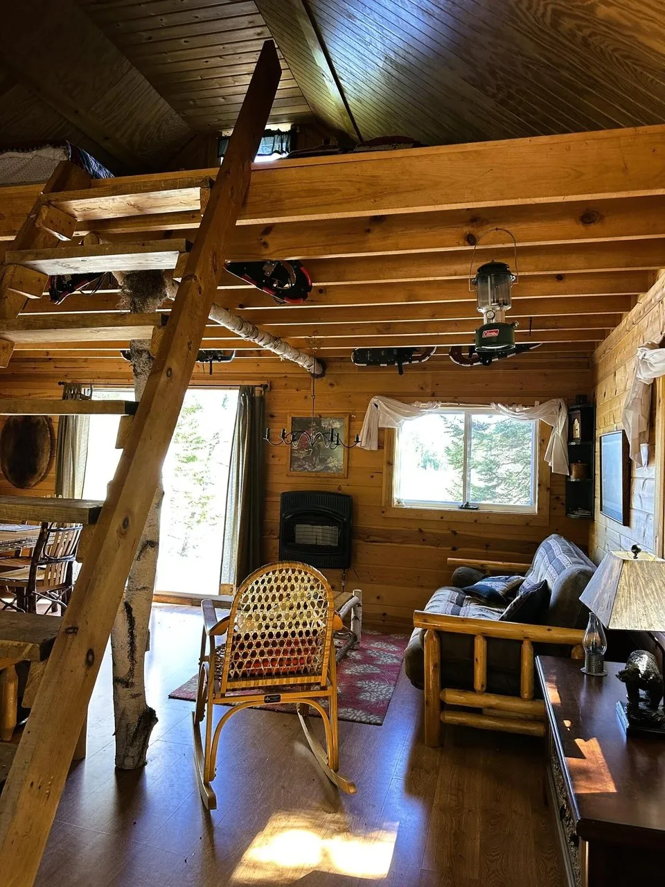 The main room from the loft ladder looking out the windows