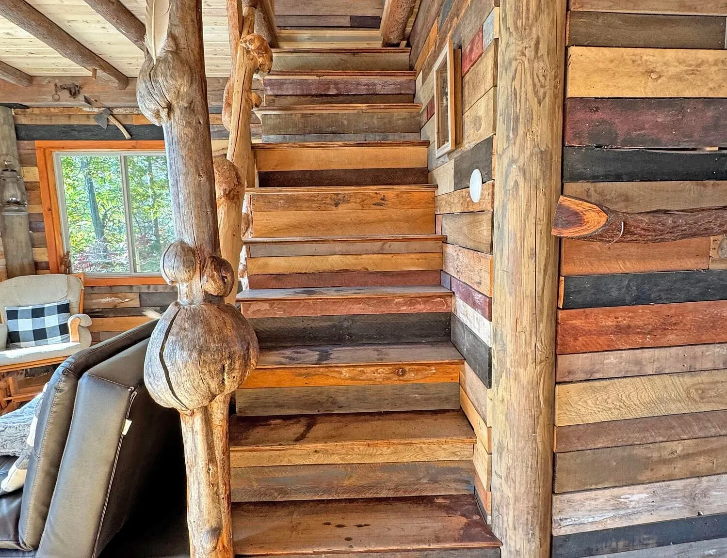The log staircase up to the loft