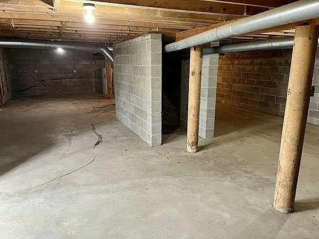 The basement with the posts and the block walls