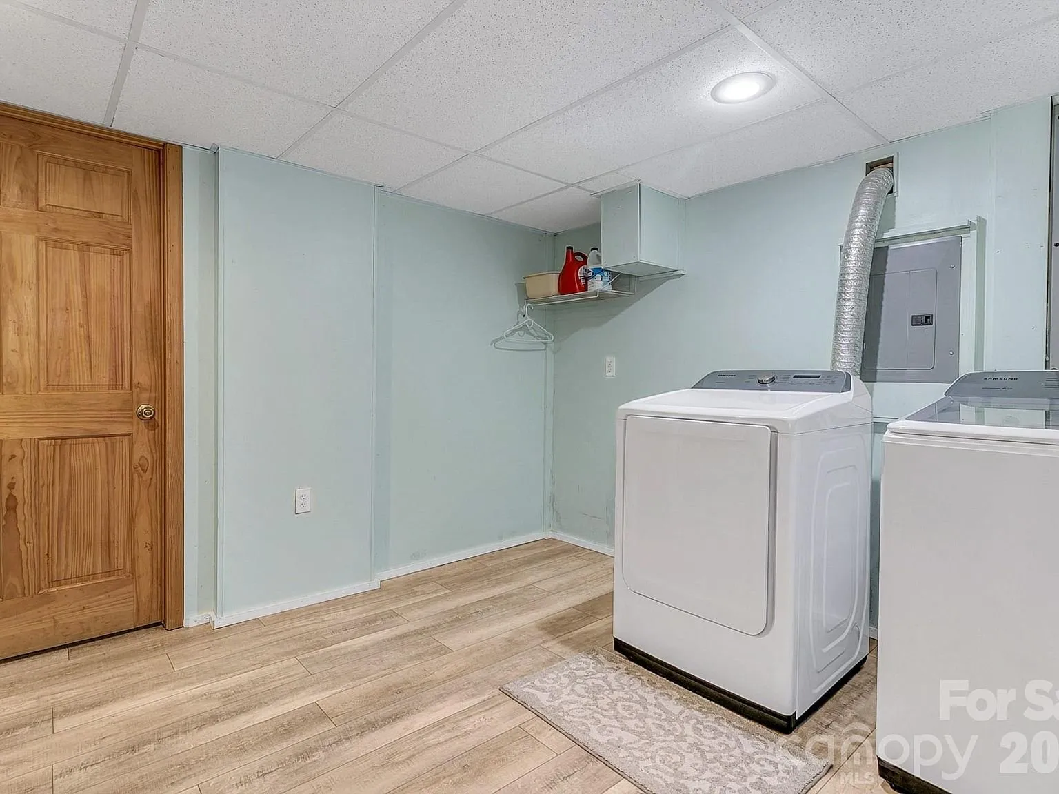 The laundry room with a washer and dryer