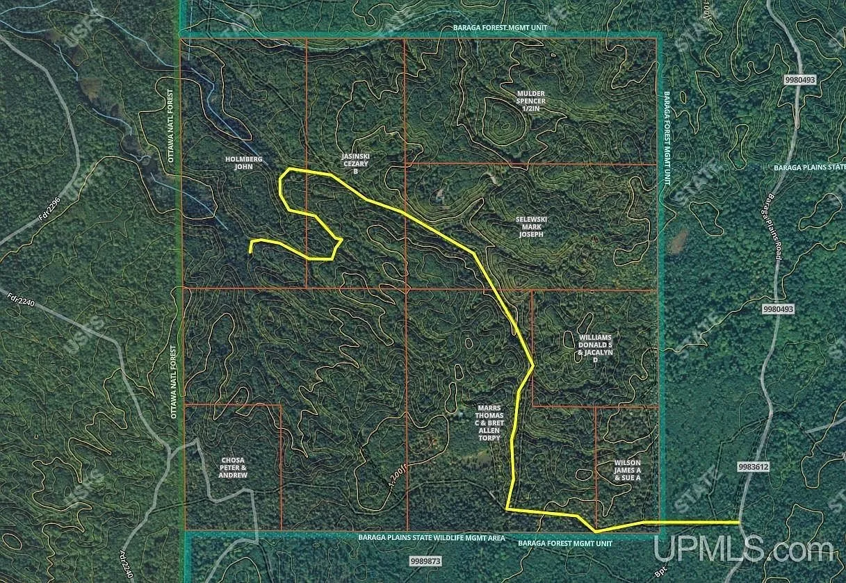 A parcel map showing the property boundary and the network of trails crossing it