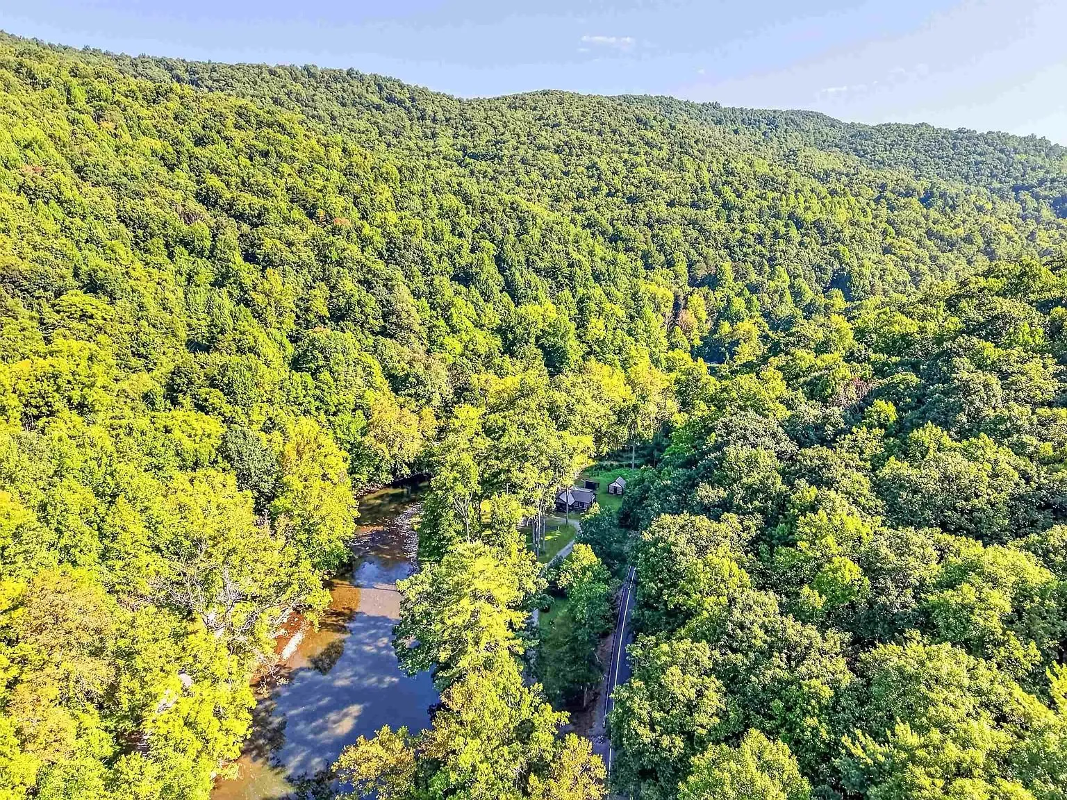 Aerial of the wooded ridge with the creek below