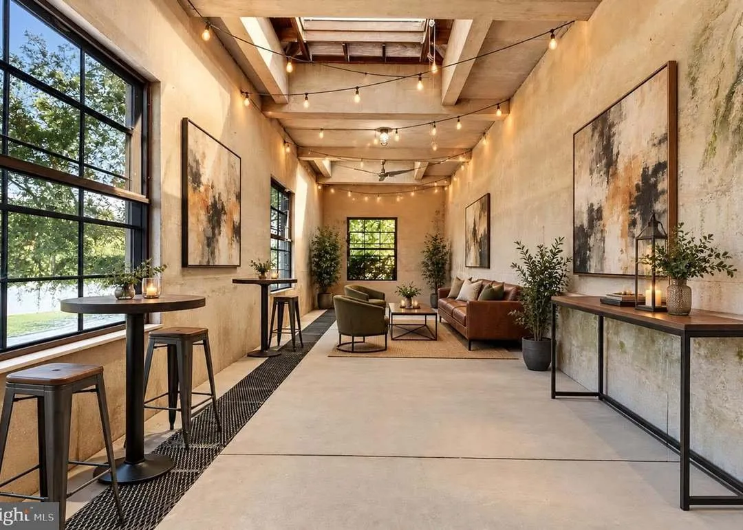Inside The River Room, with string lights, large artwork and bistro seating